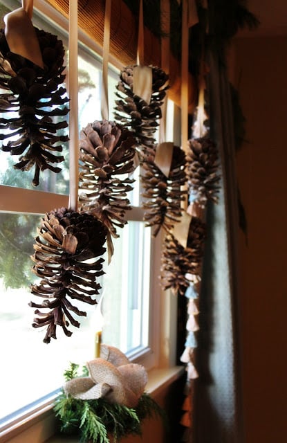 Hang Pine Cones with the Help of Fancy Ribbons for Window Decoration