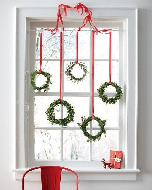 Lovely Green Wreaths Hung on Window’s Top