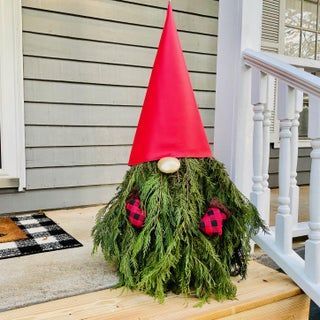 christmas gnome with evergreen branches 2