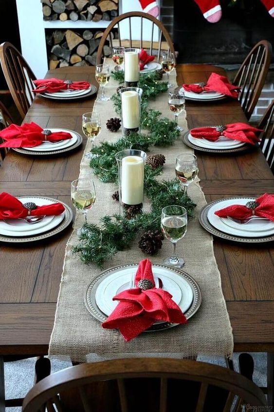 decorating a christmas table with candles