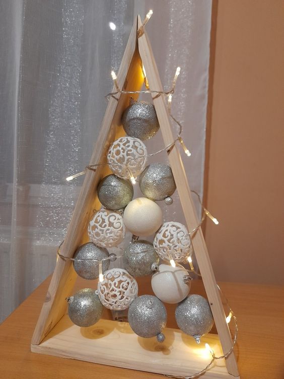 Triangular wooden Christmas tree with Christmas balls