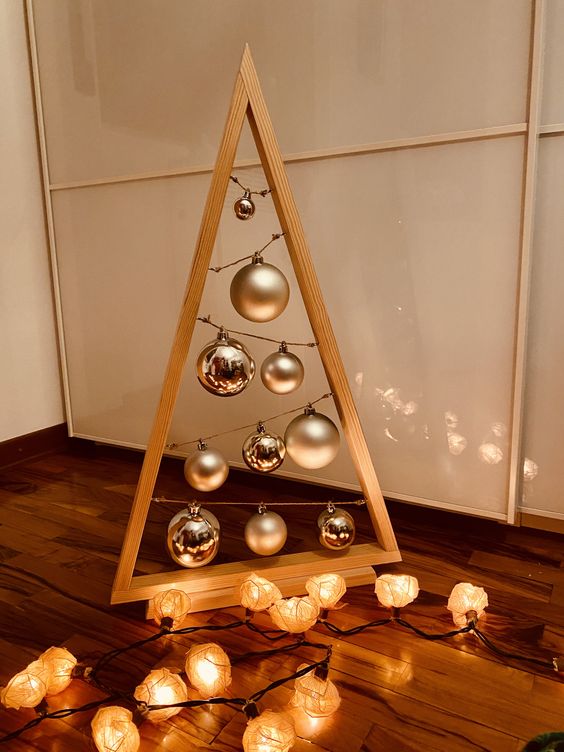 Triangular wooden Christmas tree with Christmas balls